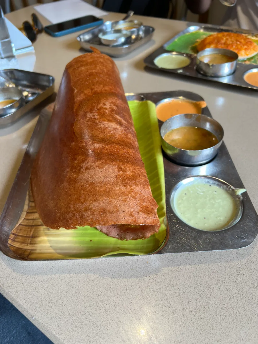 Red rice dosa with sambar and chutneys